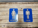 Men and woman metal bathroom door sign