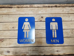Men and woman metal bathroom door sign