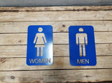 Men and woman metal bathroom door sign